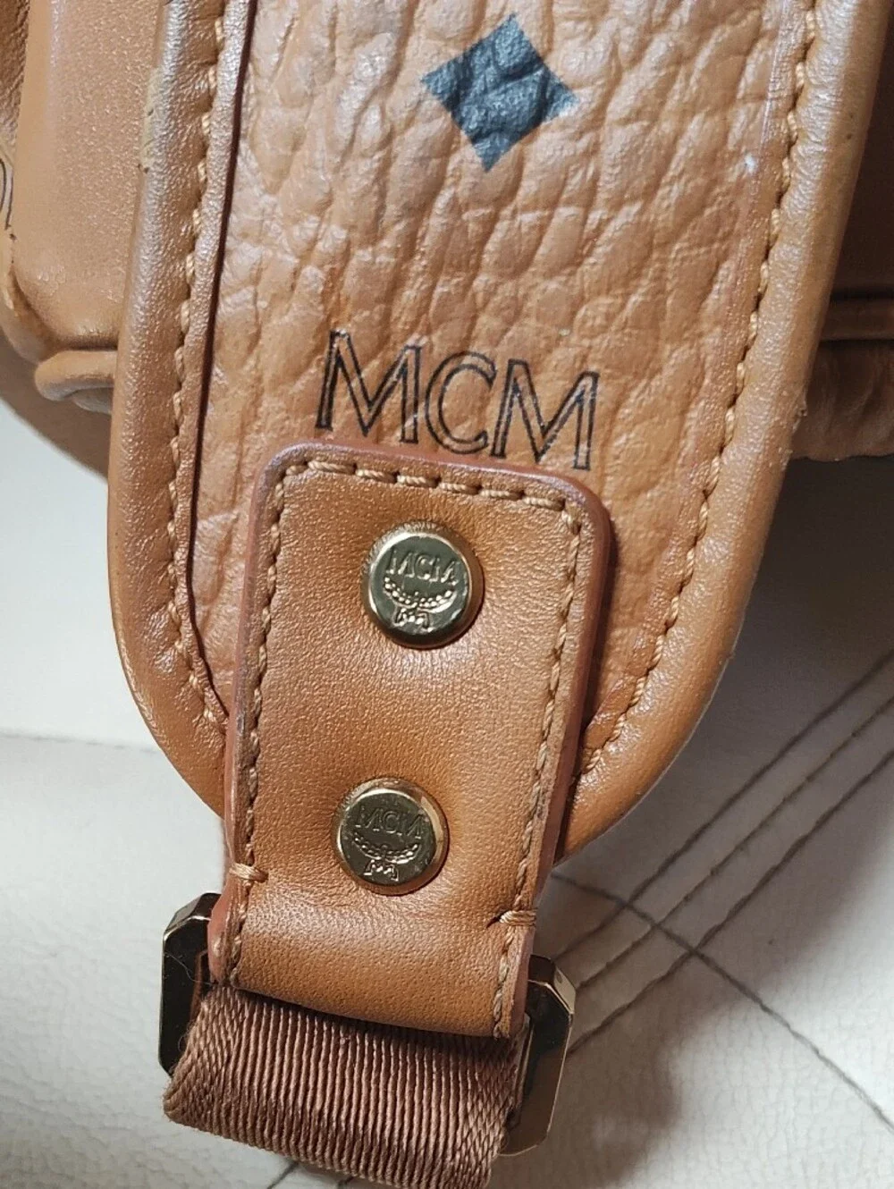 MCM Cognac Logo Print Leather Backpack with Gold Plate